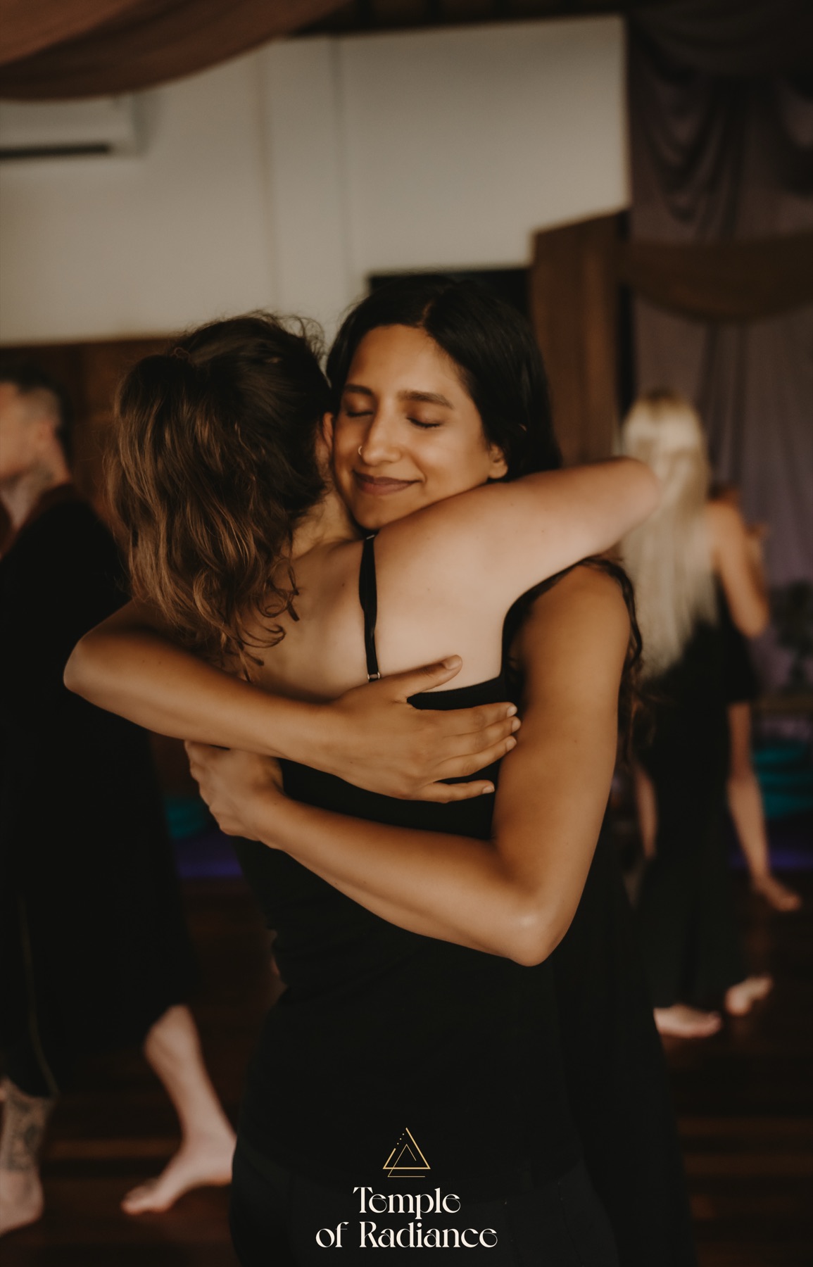 Two members embracing at a Medicine Within gathering in Amsterdam